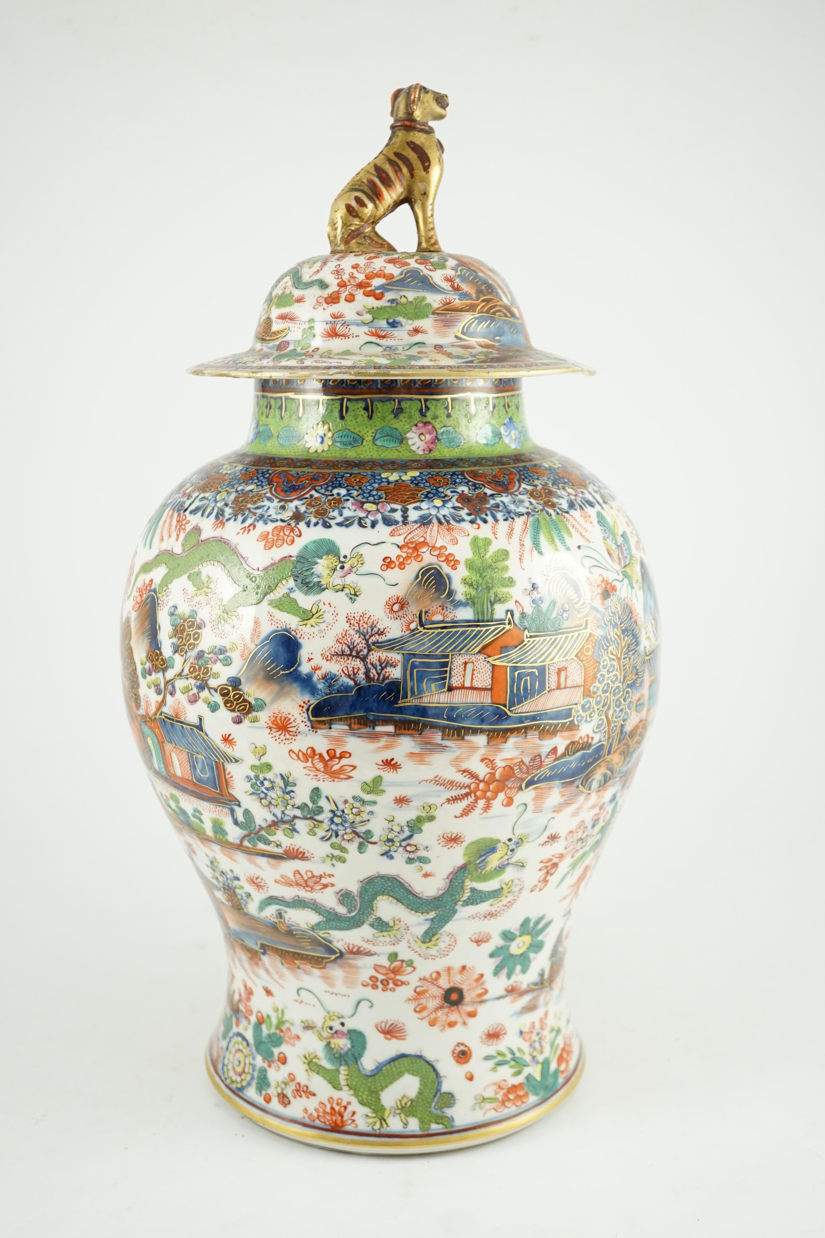 A Chinese clobbered blue and white vase and cover, 18th/19th century, 47cm high